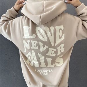 Love never fails hoodie
